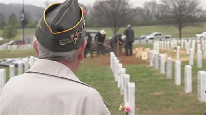 Can a spouse be buried in a military cemetery?
