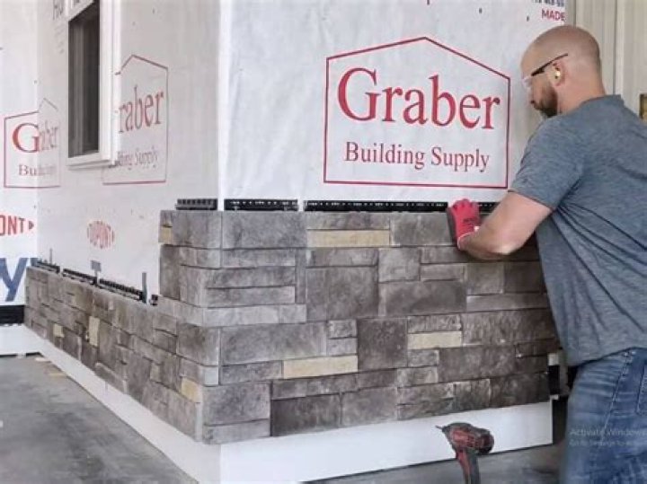 Can I install stone veneer over brick?