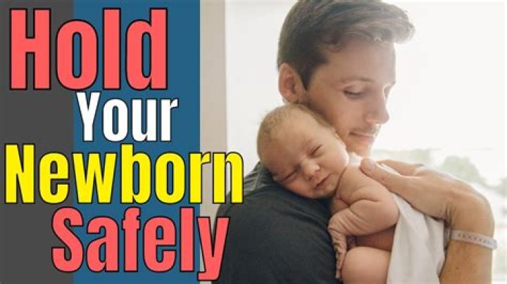 Can I touch and hold my newborn baby if I have COVID-19?