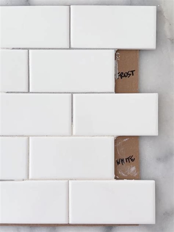 Can I use white grout on floor tiles?