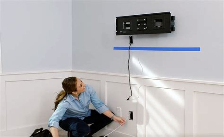 Can you run power cords behind drywall?