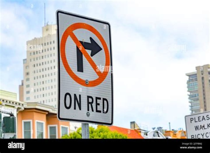 Can you turn left on a blinking red arrow?