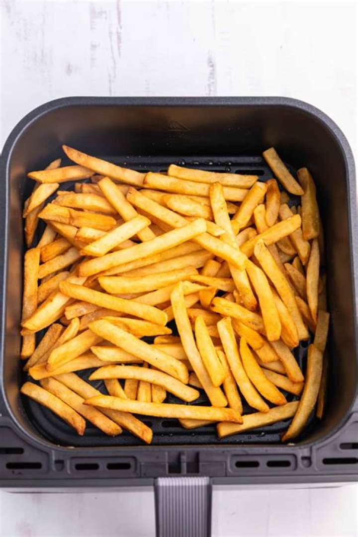 Do you spray oil on frozen French fries in air fryer?