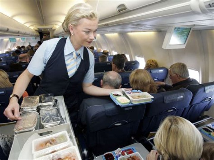 How do flight attendants serve food?