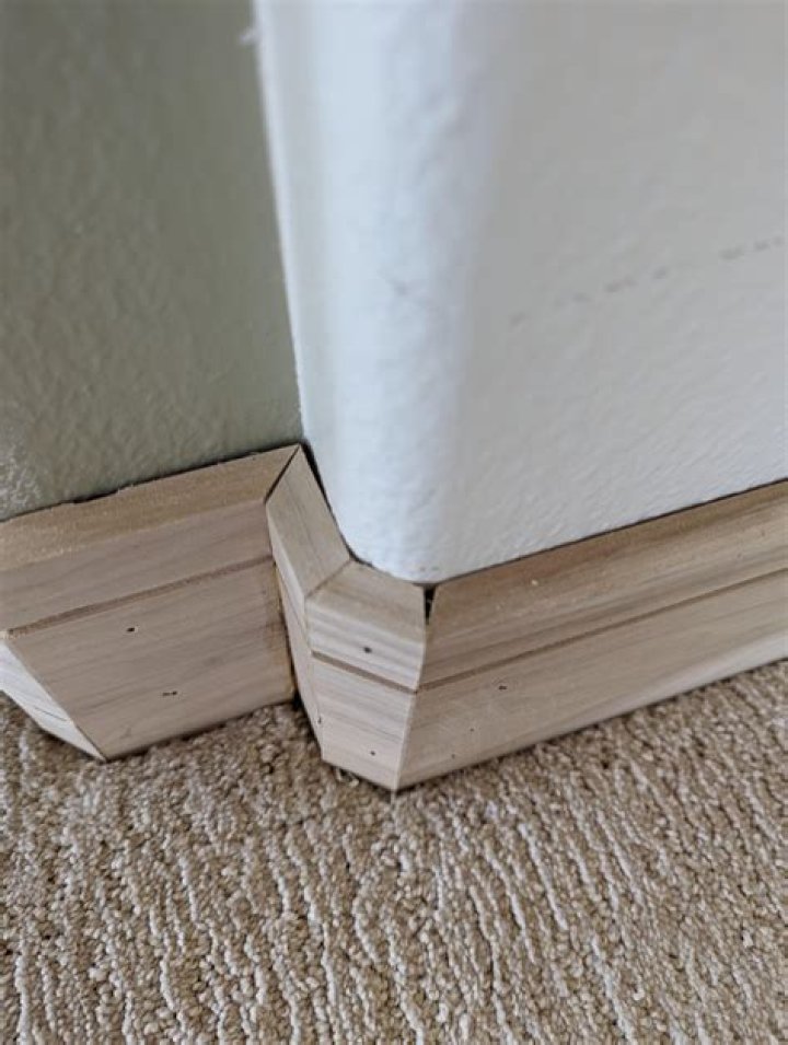 How do you fill gaps in baseboard trim?