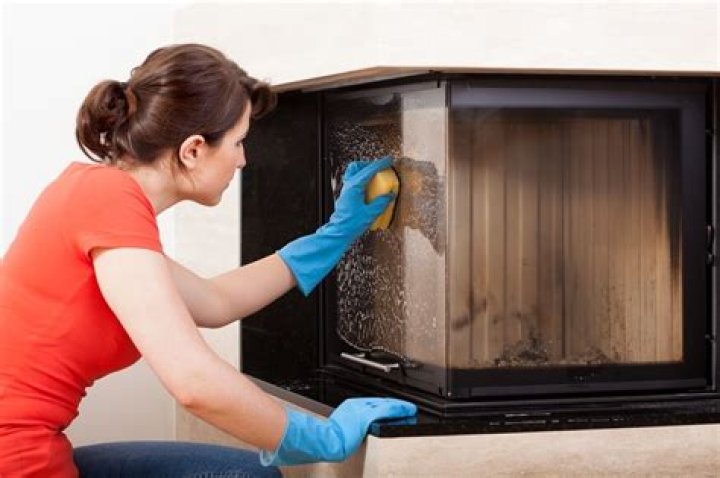How do you remove smoke stains from fireplace glass?