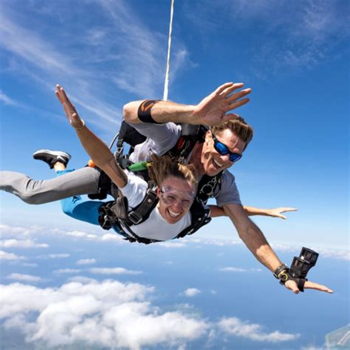 How should you wear your hair when skydiving?