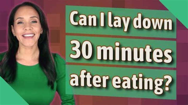 Is it better to sit or lay down after eating?
