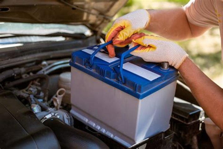 What does pouring Coke on a car battery do?