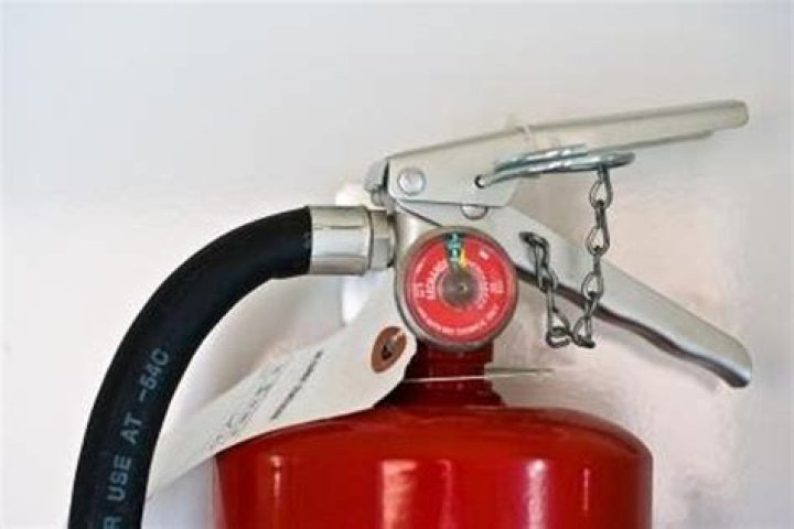 What is the correct height to hang a fire extinguisher?