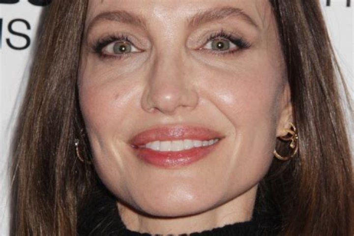 Where did Angelina Jolie learn to fly?