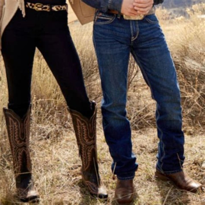 Why did cowboys wear high heeled boots?