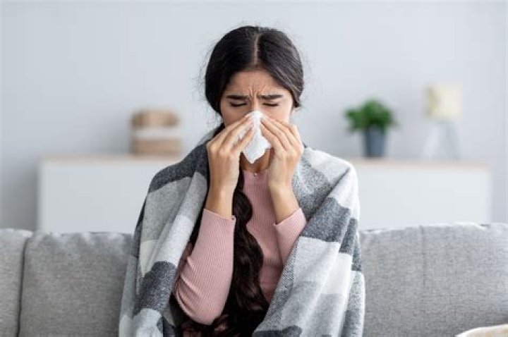 Why do I sneeze in my bedroom?