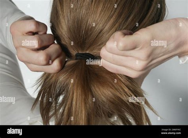Why do people throw hair ties at the top of Expedition Everest?