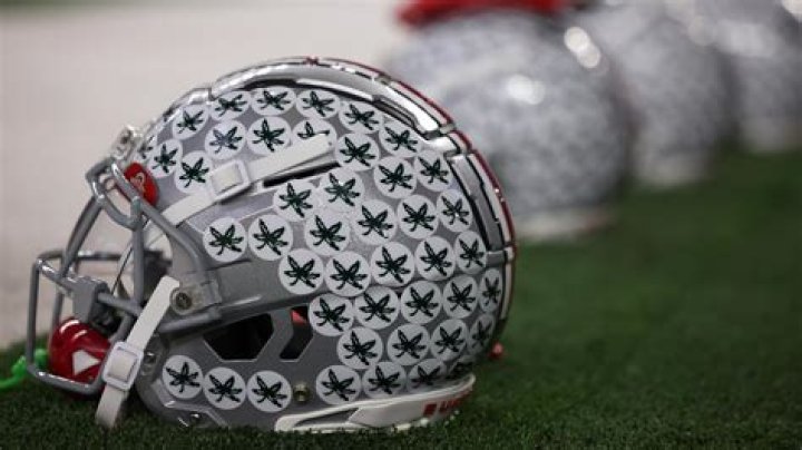 Why does Burrow have a green sticker on his helmet?